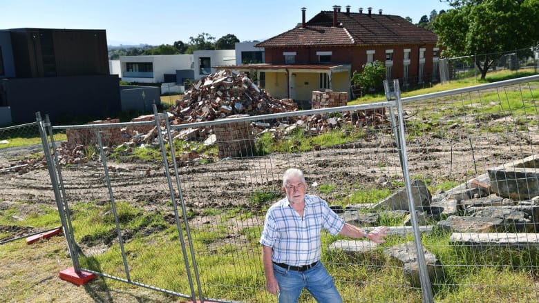 Former boss of the old
                                          Kew insitution Max Jackson
                                          amongst dilapidated heritage
                                          buildings